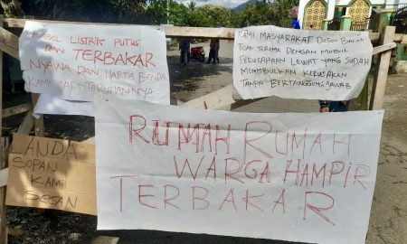 Kendaraan berat PT. Masmindo Dwi Area memutuskan kabel listrik PLN ke rumah warga di Dusun Baloa, Desa Bonelemo, Kecamatan Bajo Barat, Luwu, Senin (15/9/2025).